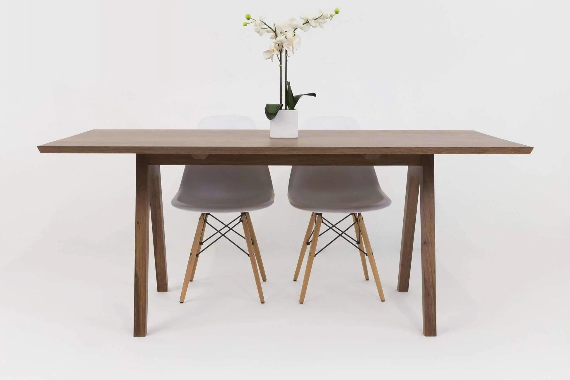 Sputnik Scandinavian Modern Dining Table with a focus on its sleek lines