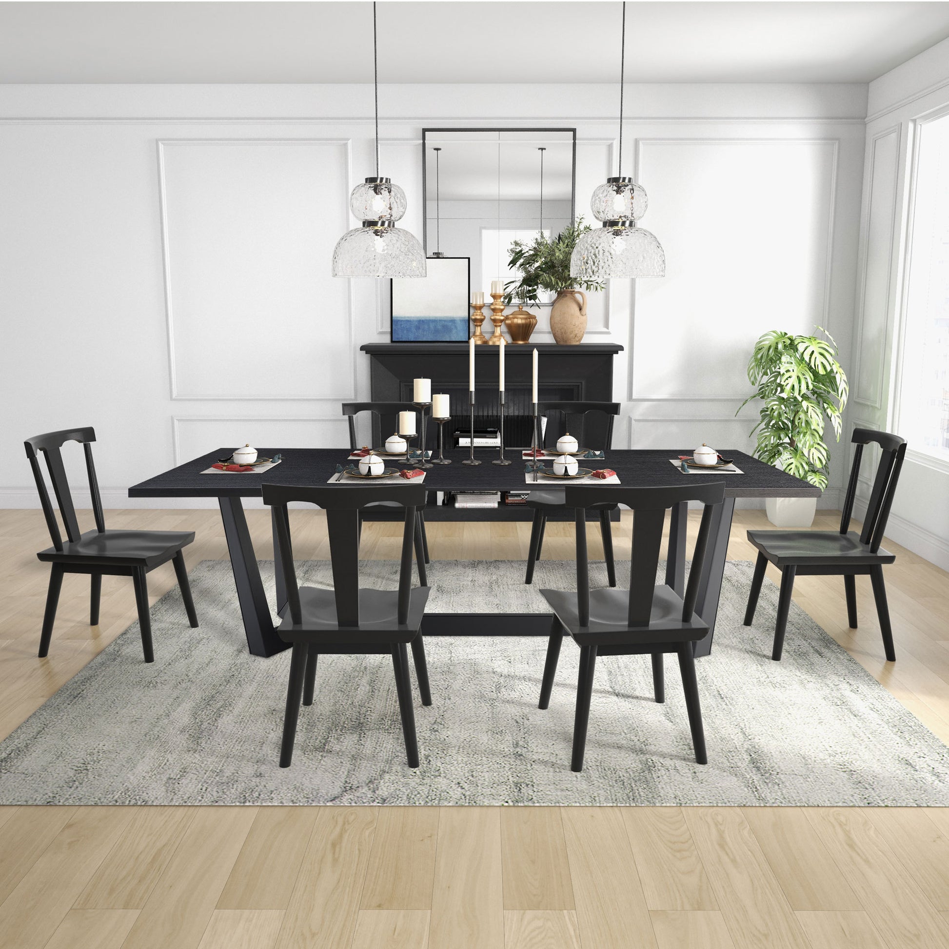 a dining room table with chairs and a rug