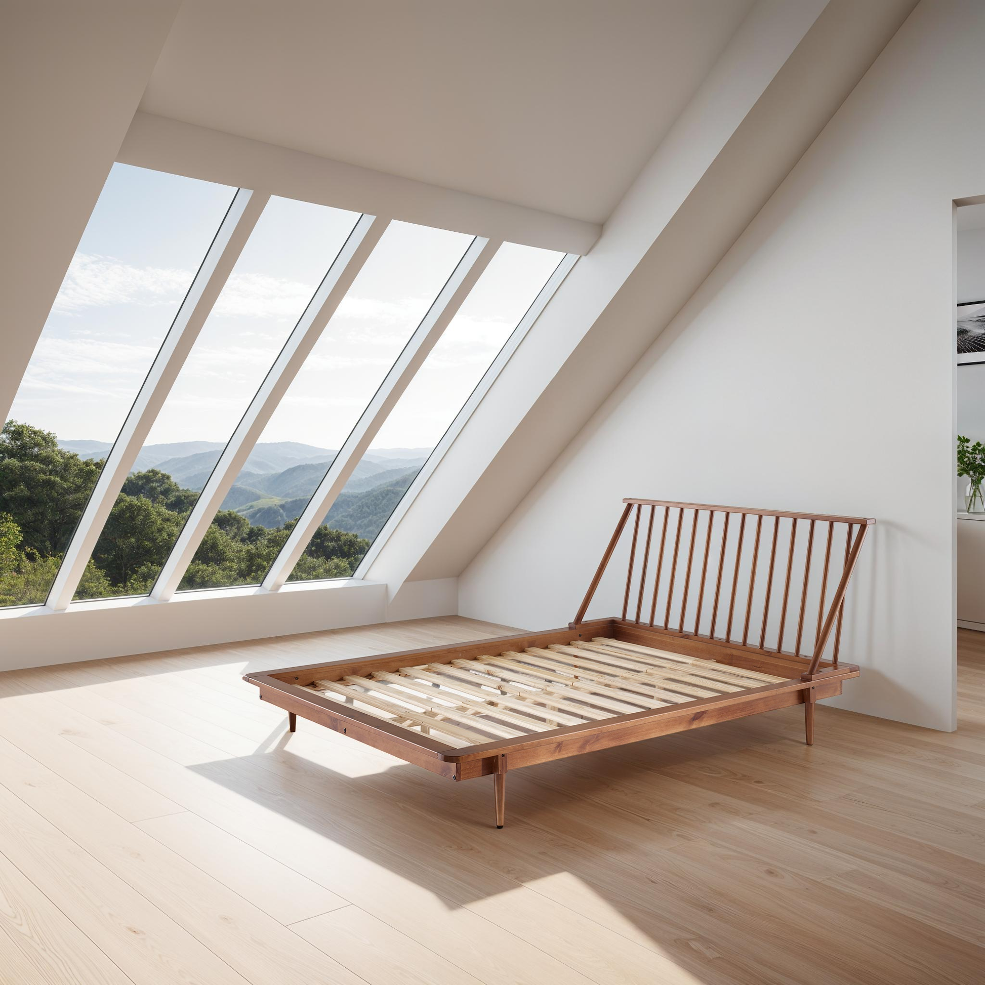 a bed sitting in a room under a window