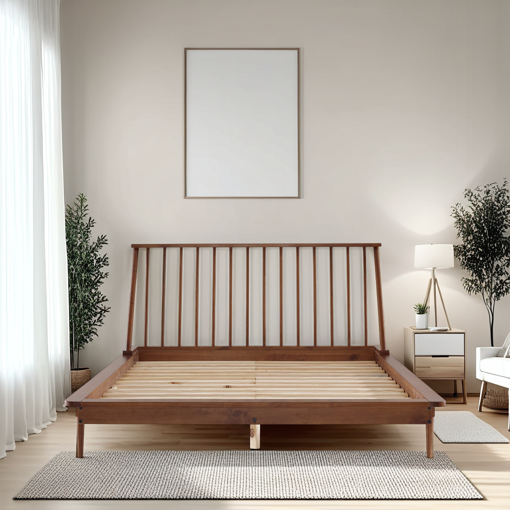 a bedroom with a wooden bed frame and white walls