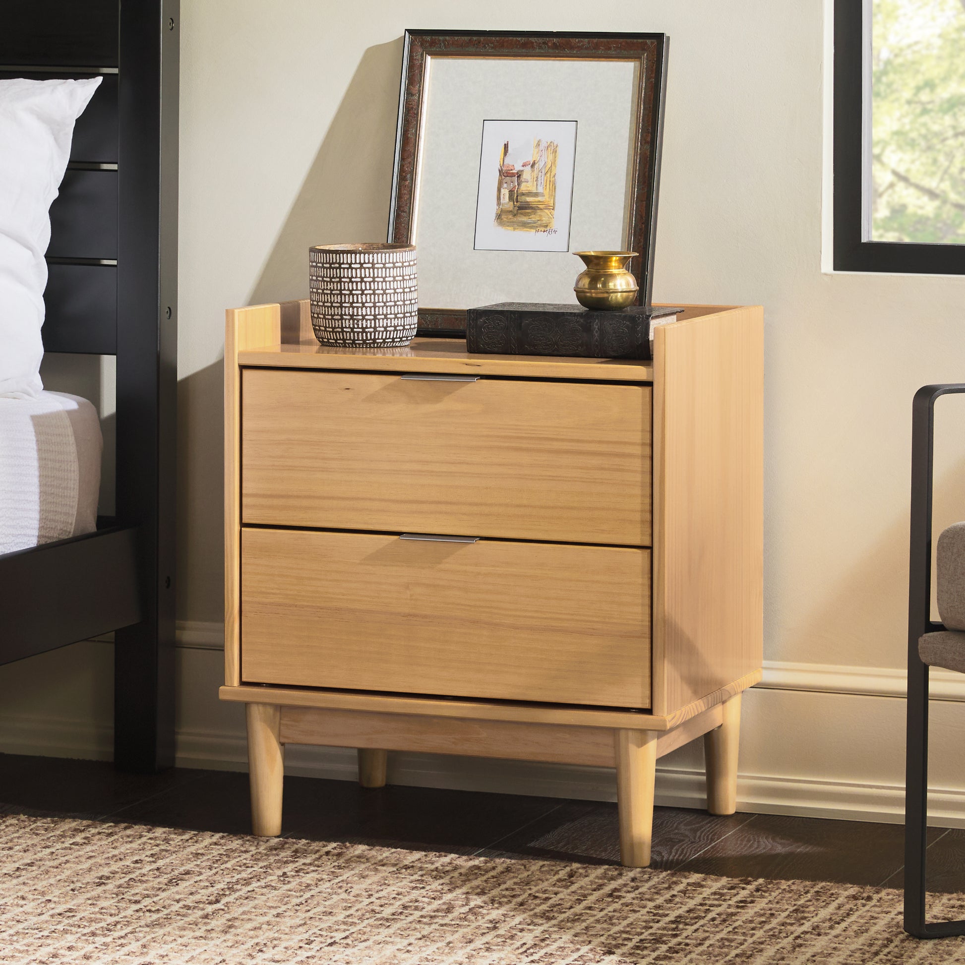 a wooden dresser with a picture on top of it