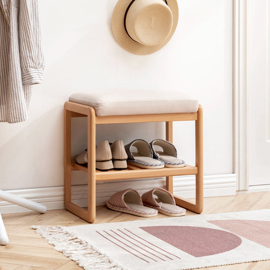 Natural Solid Wood Shoe Bench featuring two-tier shelves with shoes, plush cushioning, and a sturdy beech wood frame, highlighting functionality and elegance.