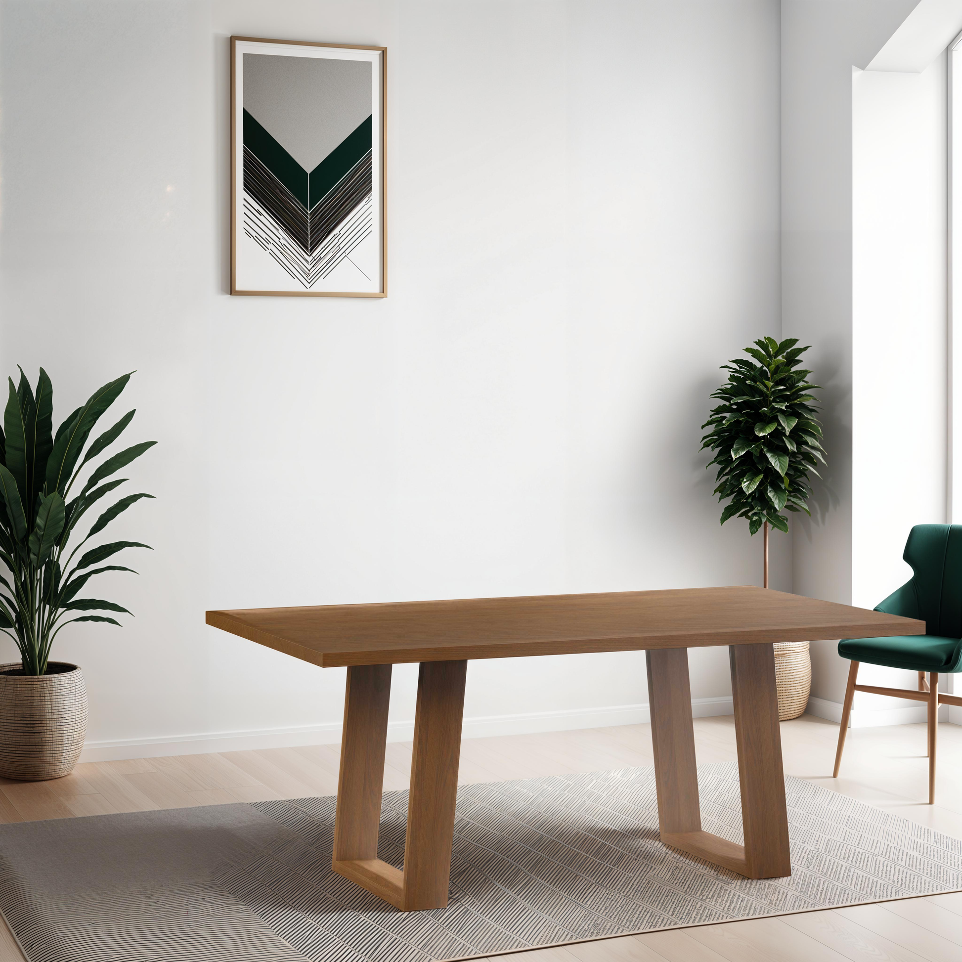 a wooden table sitting in a living room next to a potted plant