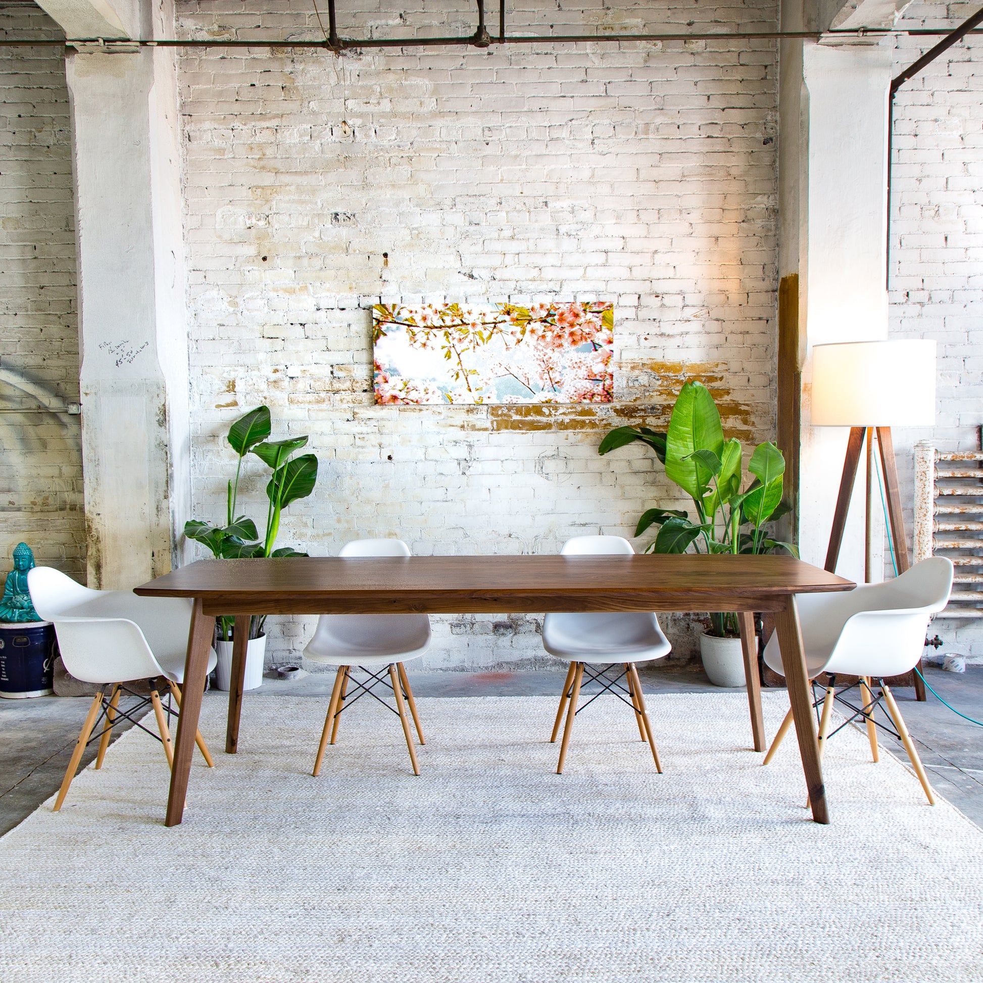 Enhance your dining room with this chic walnut table, a masterpiece of mid-century design and sustainable craftsmanship.