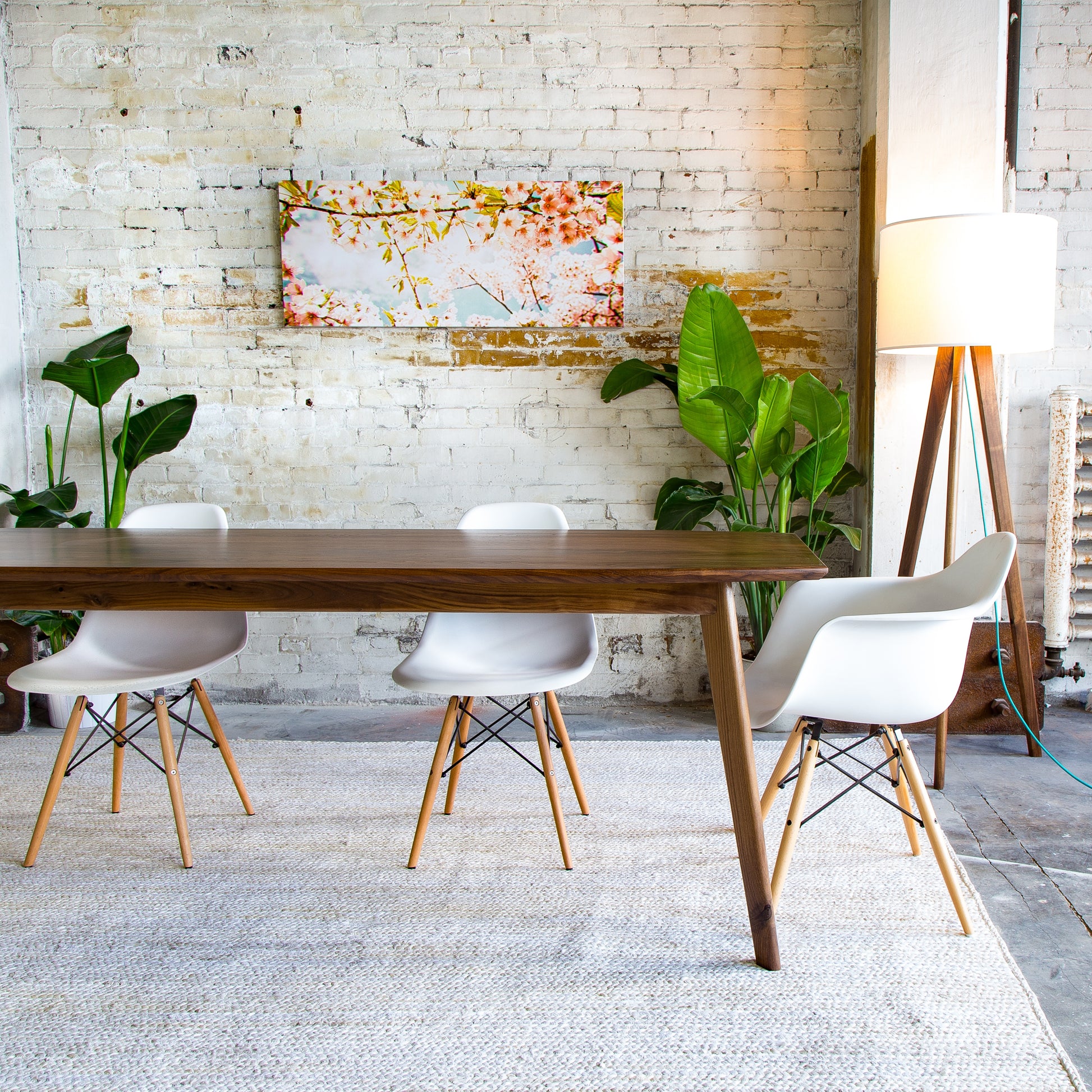 The Santa Monica table offers a blend of vintage style and modern durability, crafted from solid walnut.
