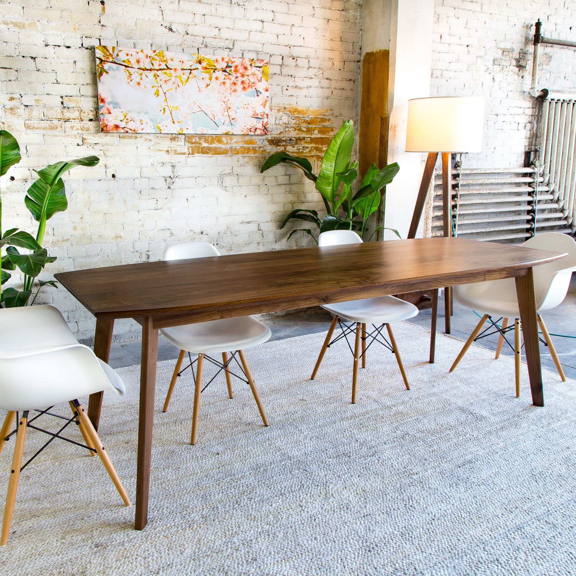 Experience the beauty of mid-century craftsmanship with this elegant walnut dining table, perfect for modern homes.






