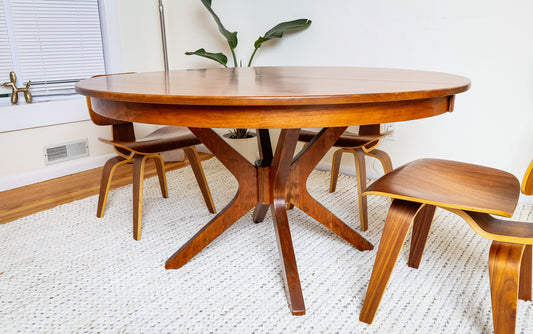 The Corcovado: Modern Small Dining Table, round wooden design with chairs, extendable for 4 to 8 people, crafted from solid hardwood.