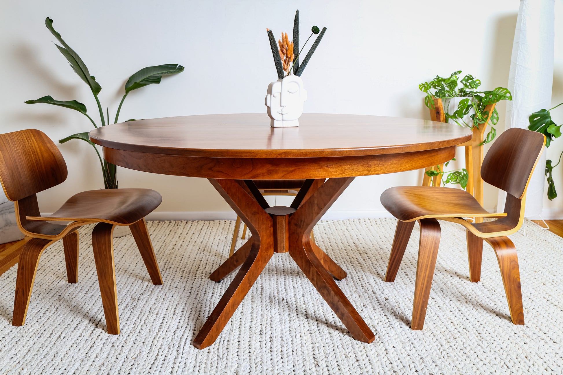 Corcovado: Modern Small Dining Table, shown with chairs, in a room setting, illustrating its extendable design for seating 4 to 8 people.