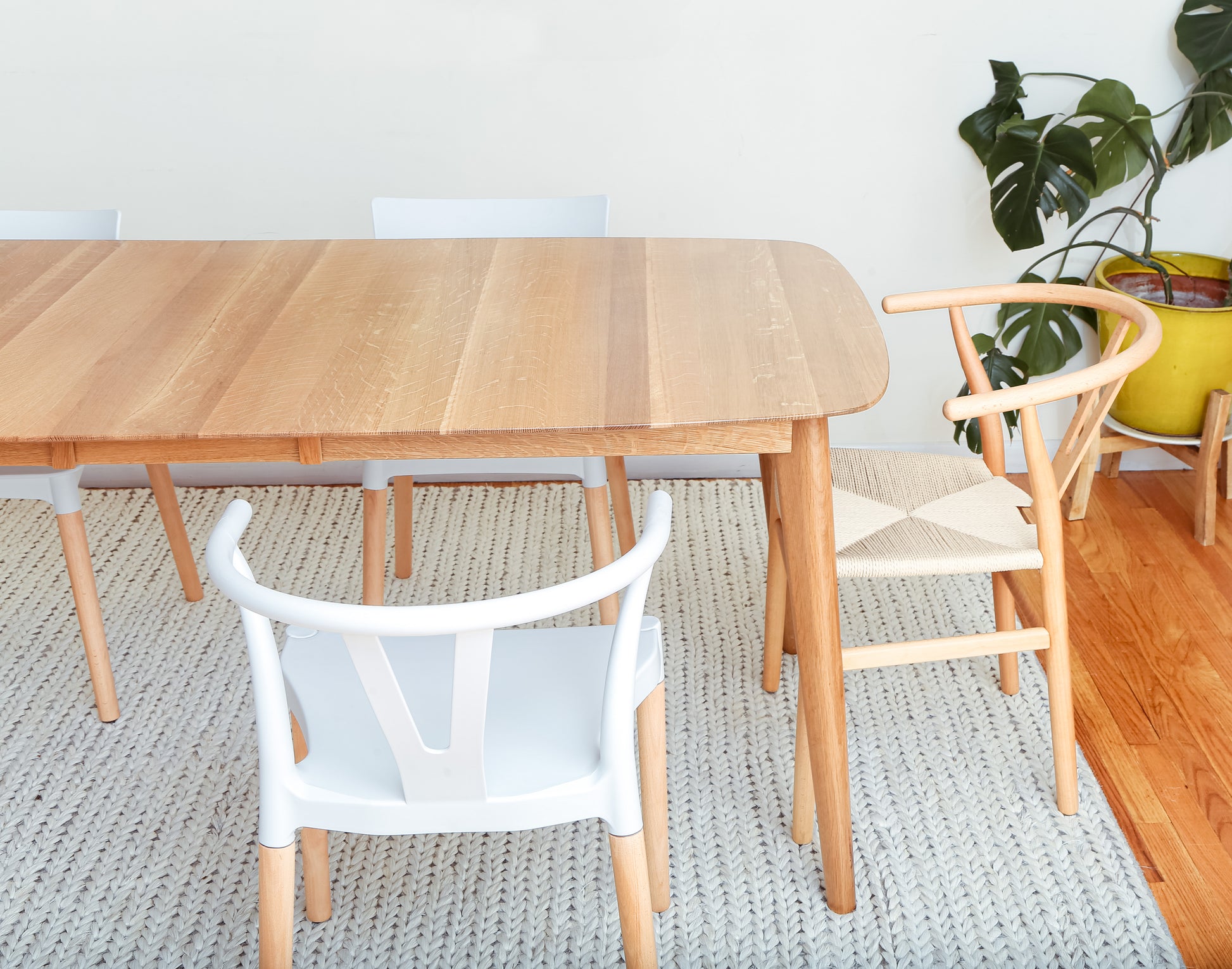 Oval extendable dining table with solid hardwood construction
