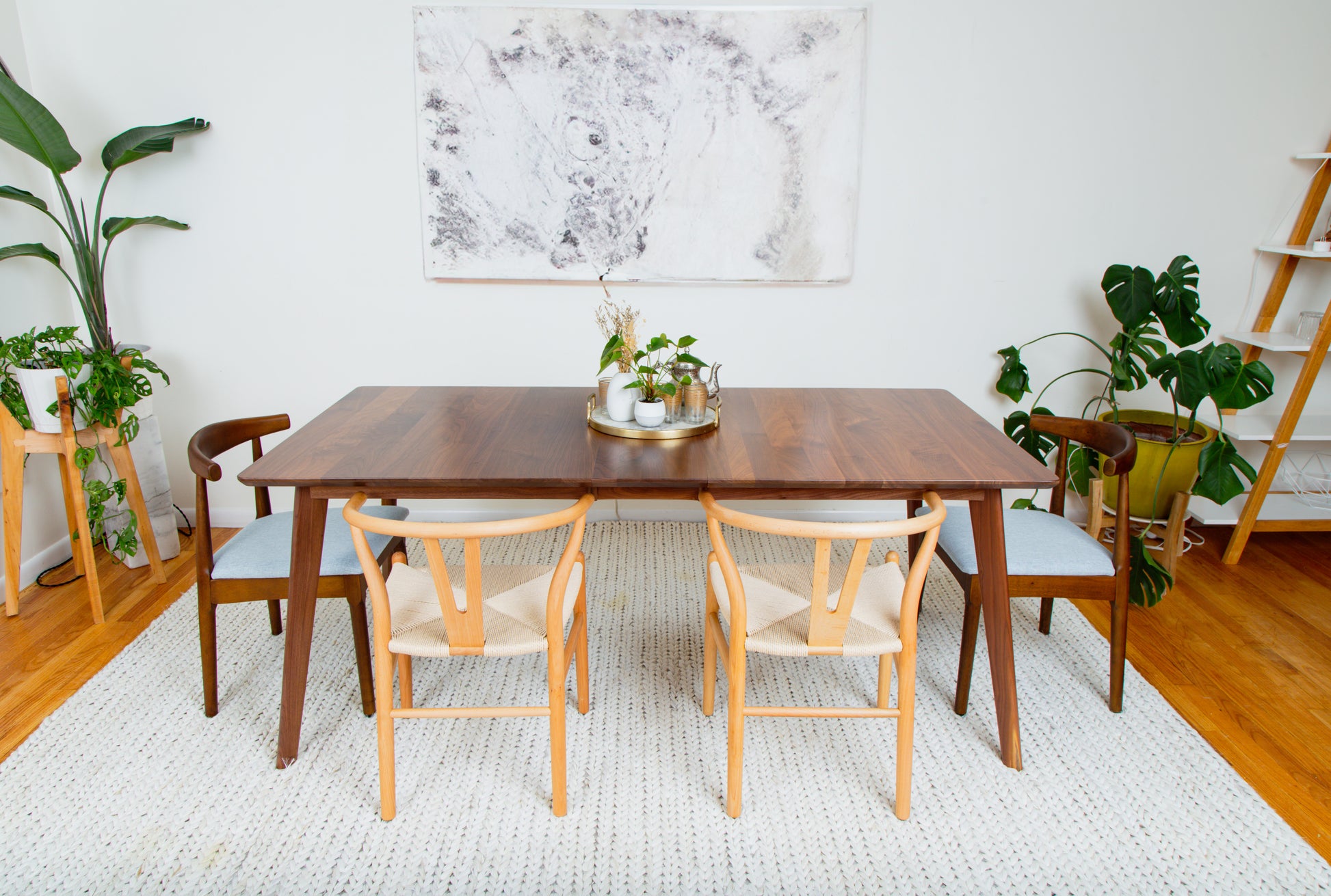 a dining room table with chairs around it