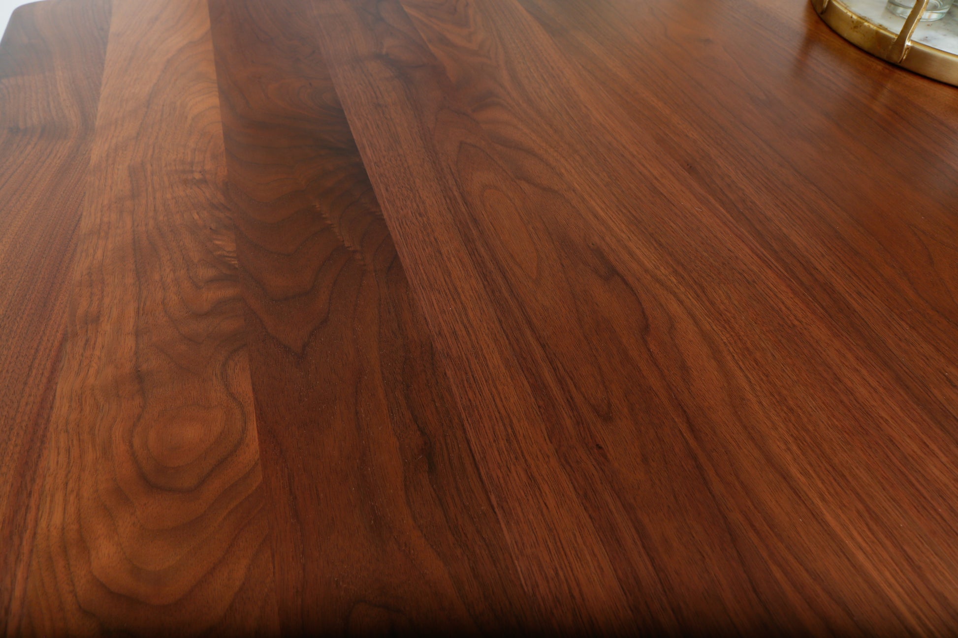 a close up of a wooden table with a clock on it