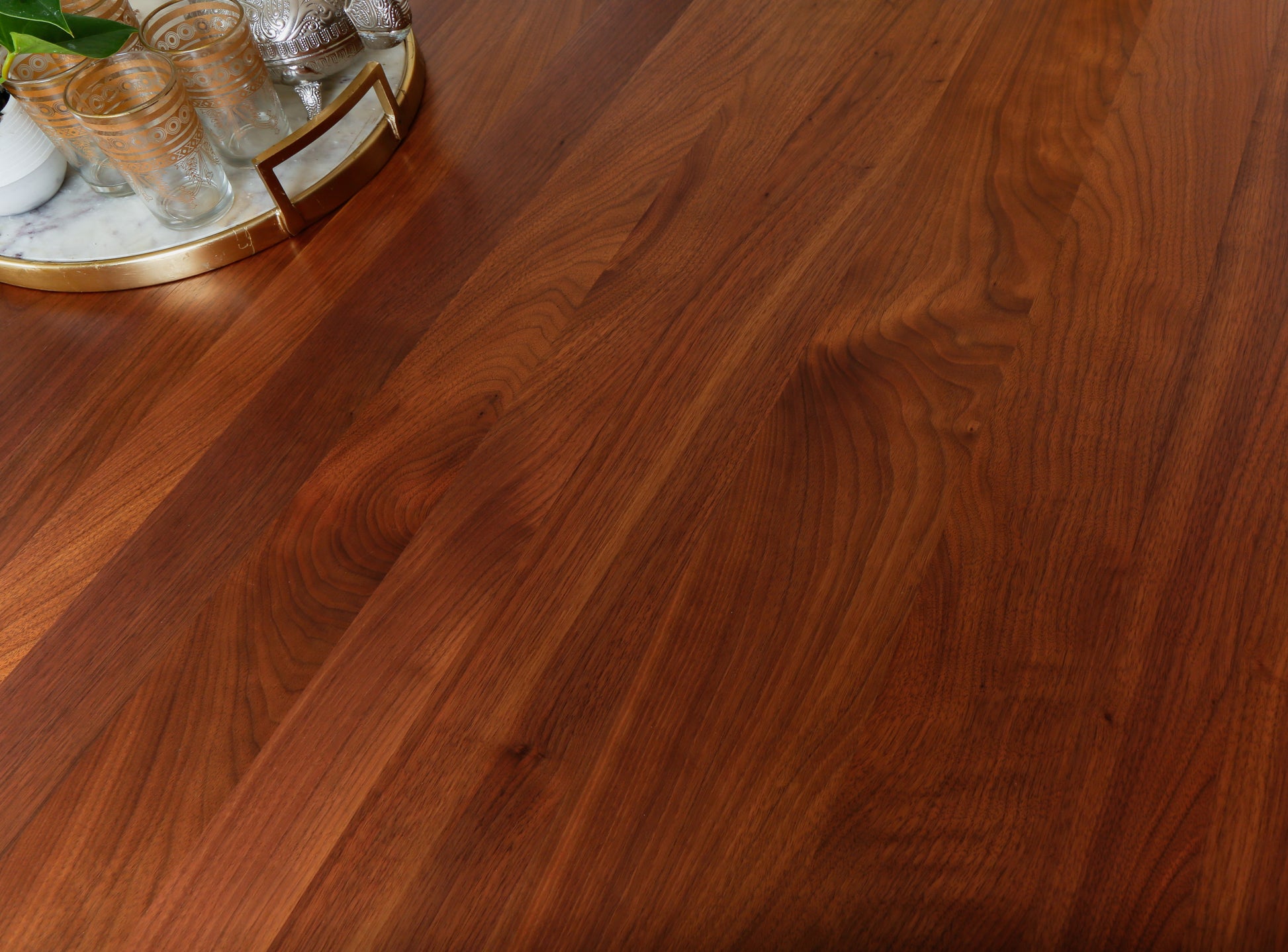 a close up of a wooden table with a mirror