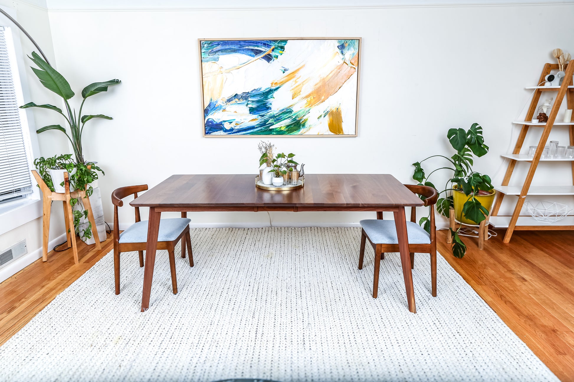 a dining room with a table and chairs