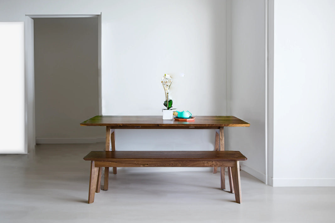 Close-up of the mixed walnut variations in the Sputnik dining table and bench