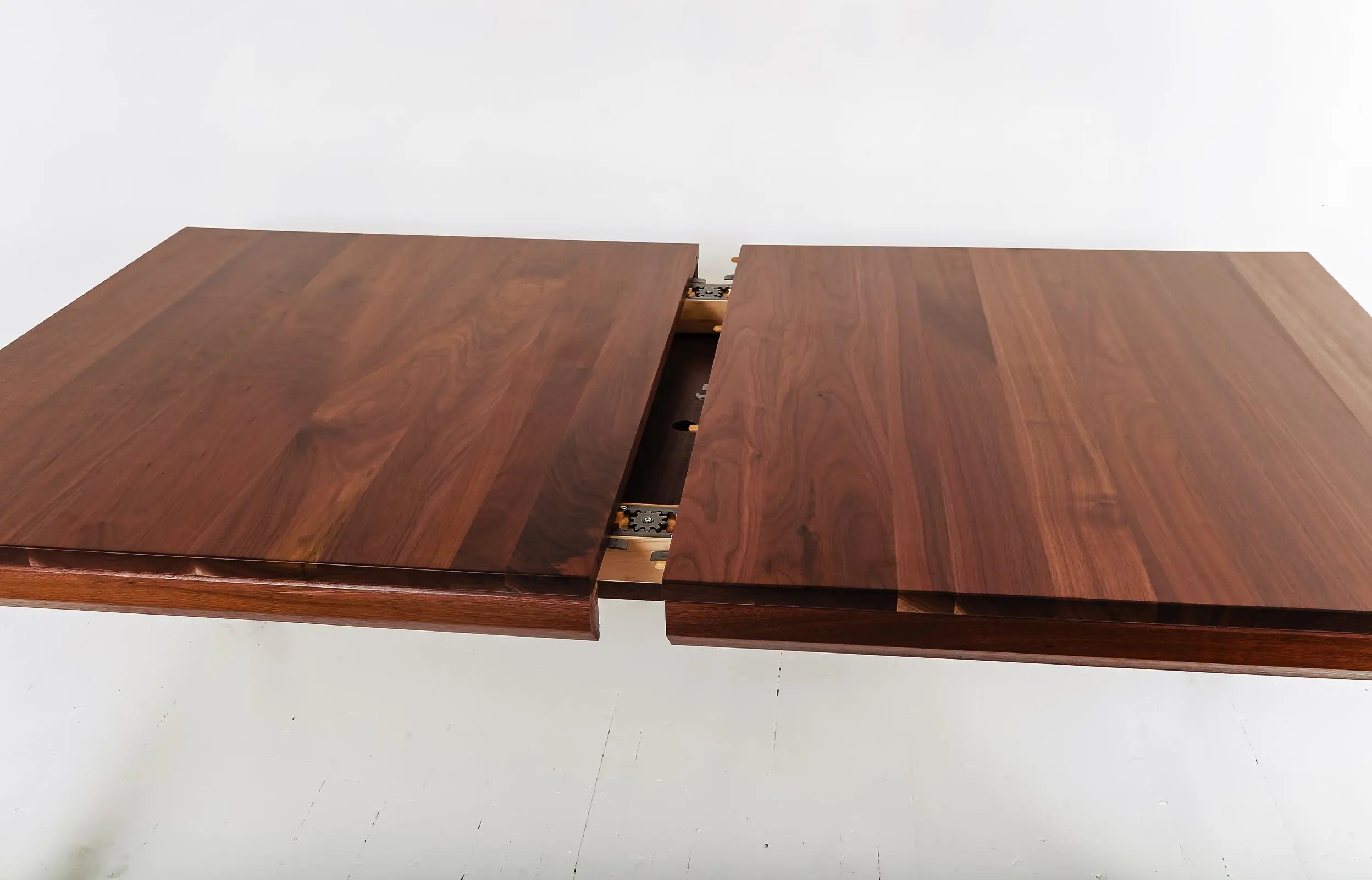 Minimalist Design dining table in walnut with leaves