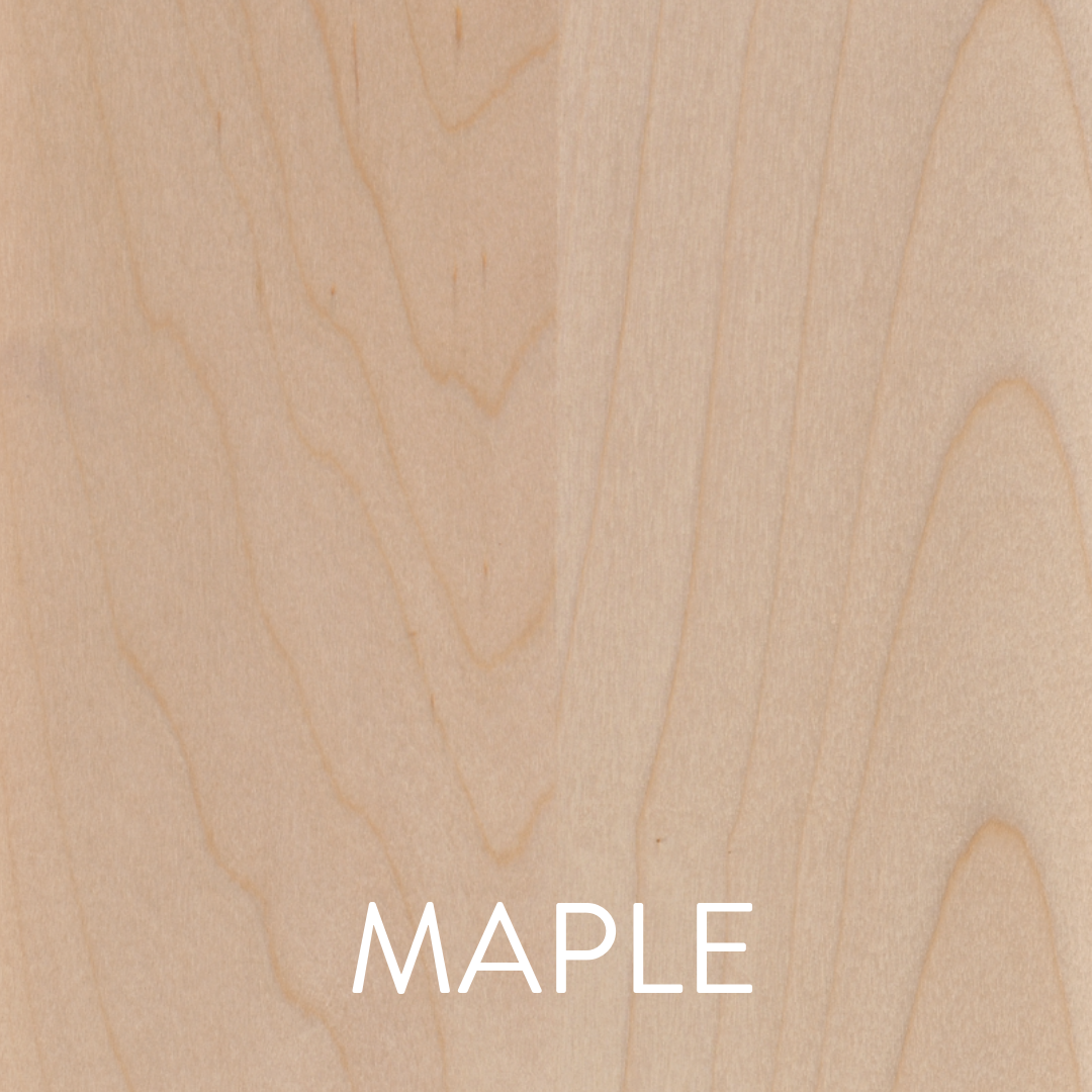 a close up of a piece of wood with the word maple on it