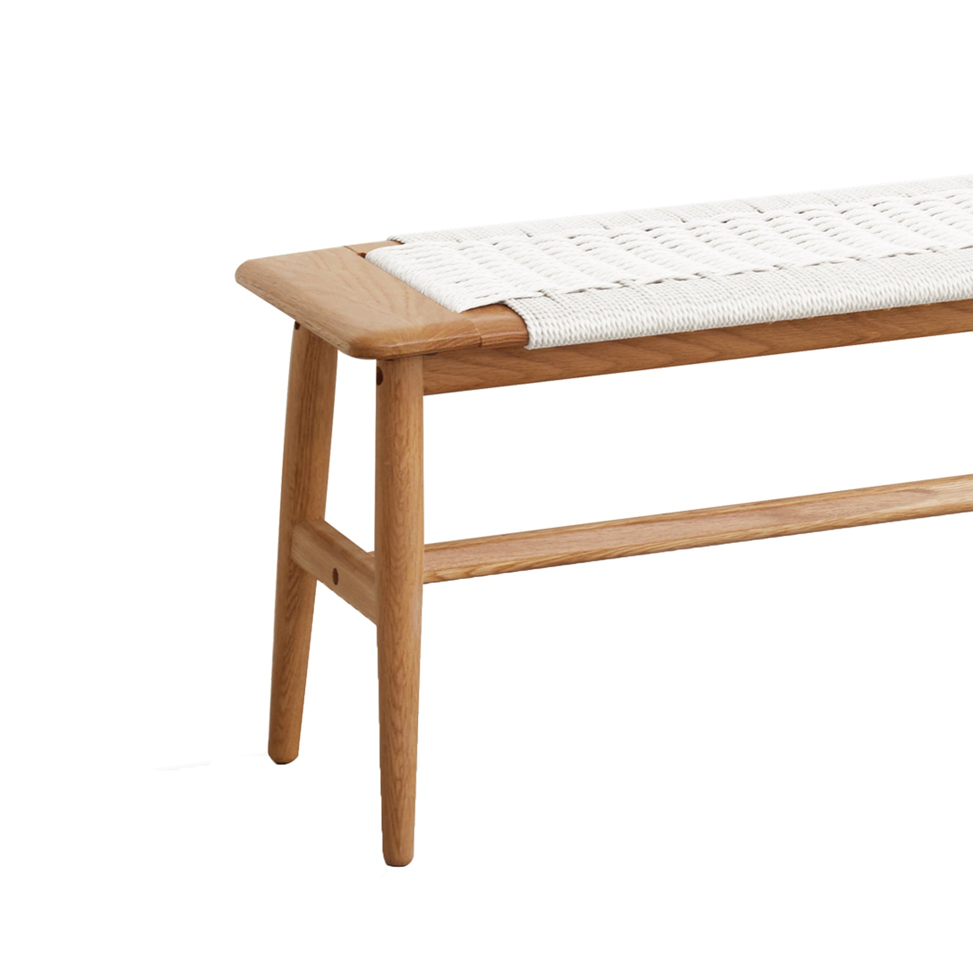 a wooden bench with a woven seat cushion