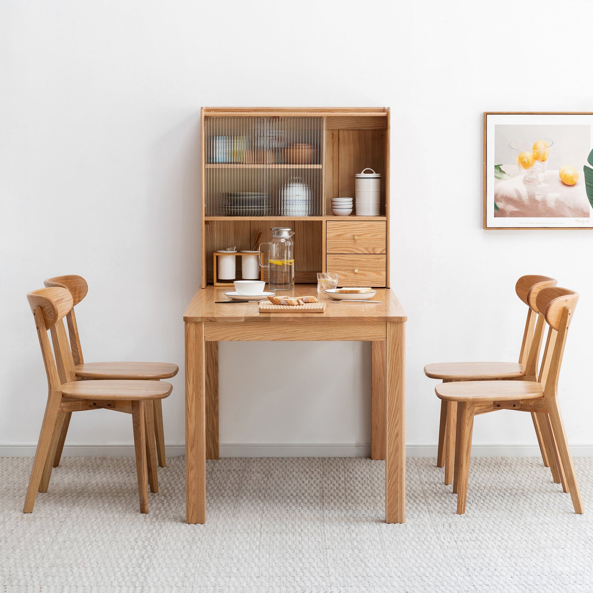 a wooden desk with two chairs and a hutch