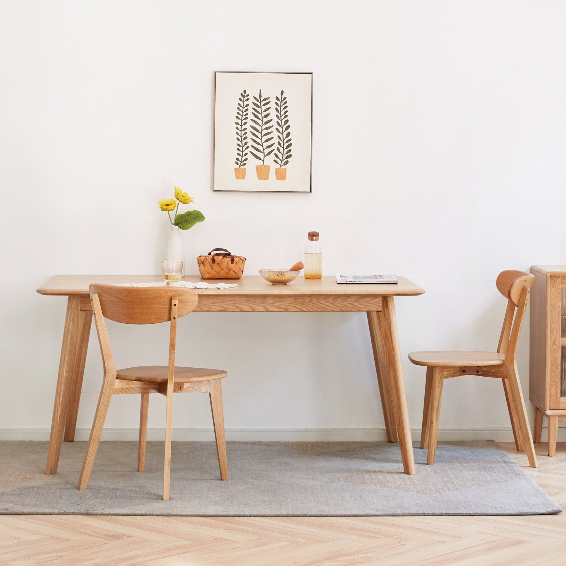 a wooden table and chairs in a room