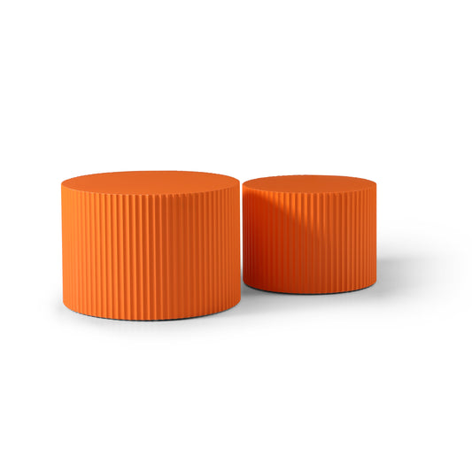 a pair of orange stools sitting next to each other