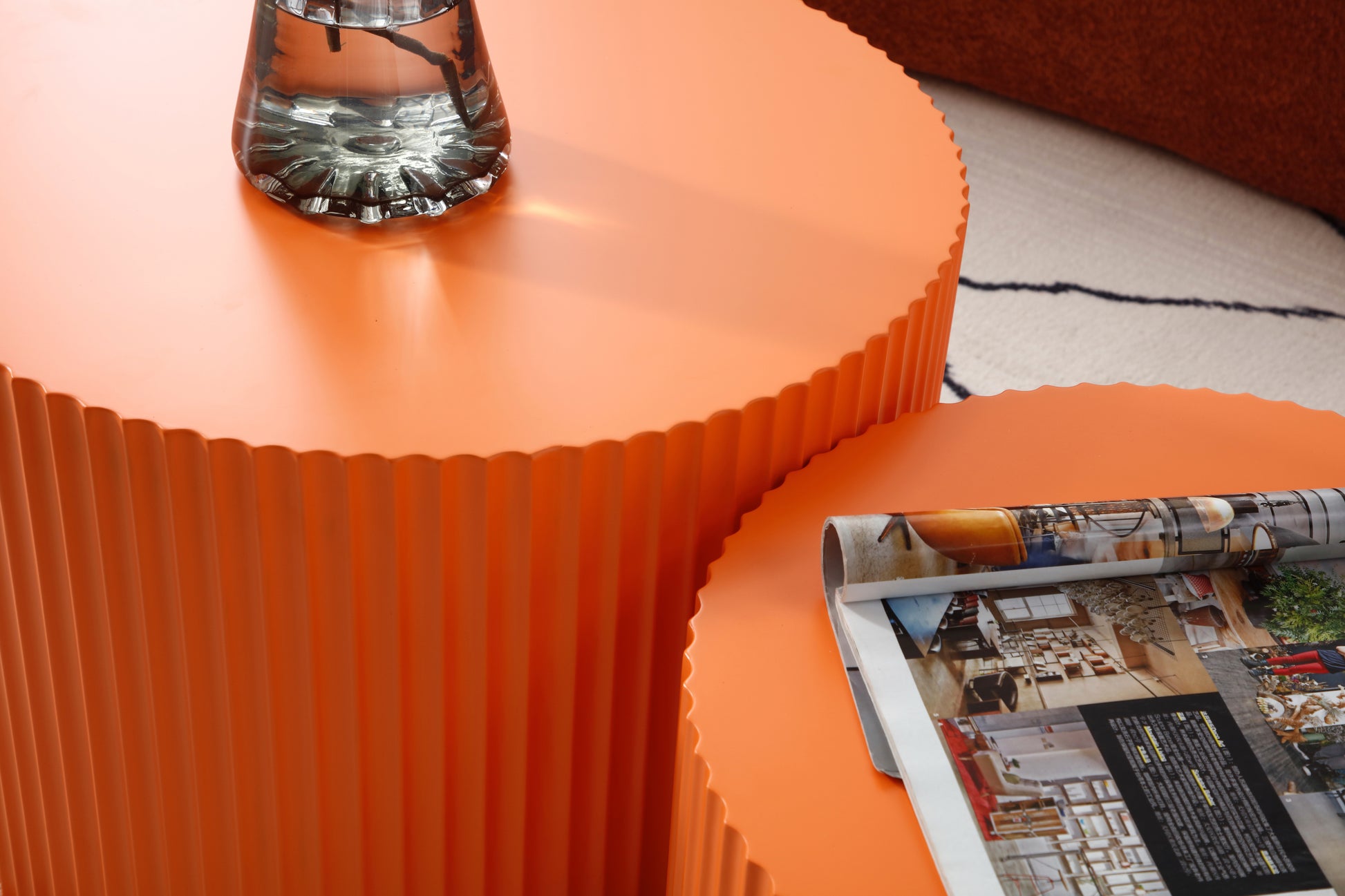 an orange table with a magazine on top of it