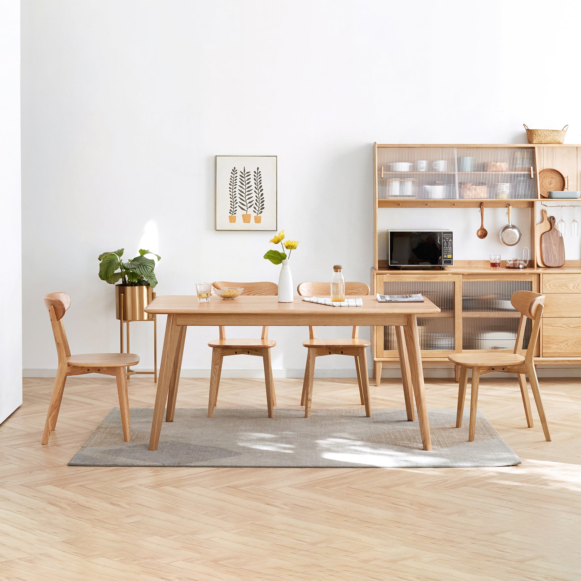 a wooden table and chairs in a room