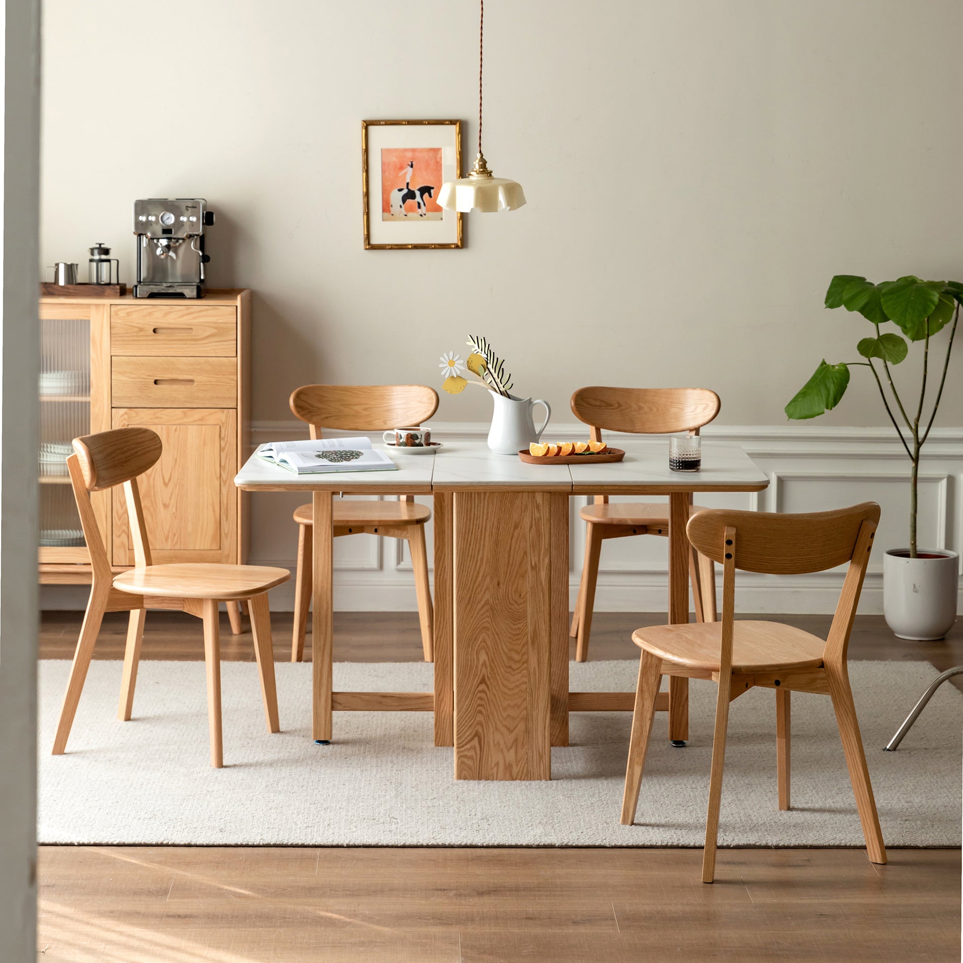 a dining room with a table and chairs