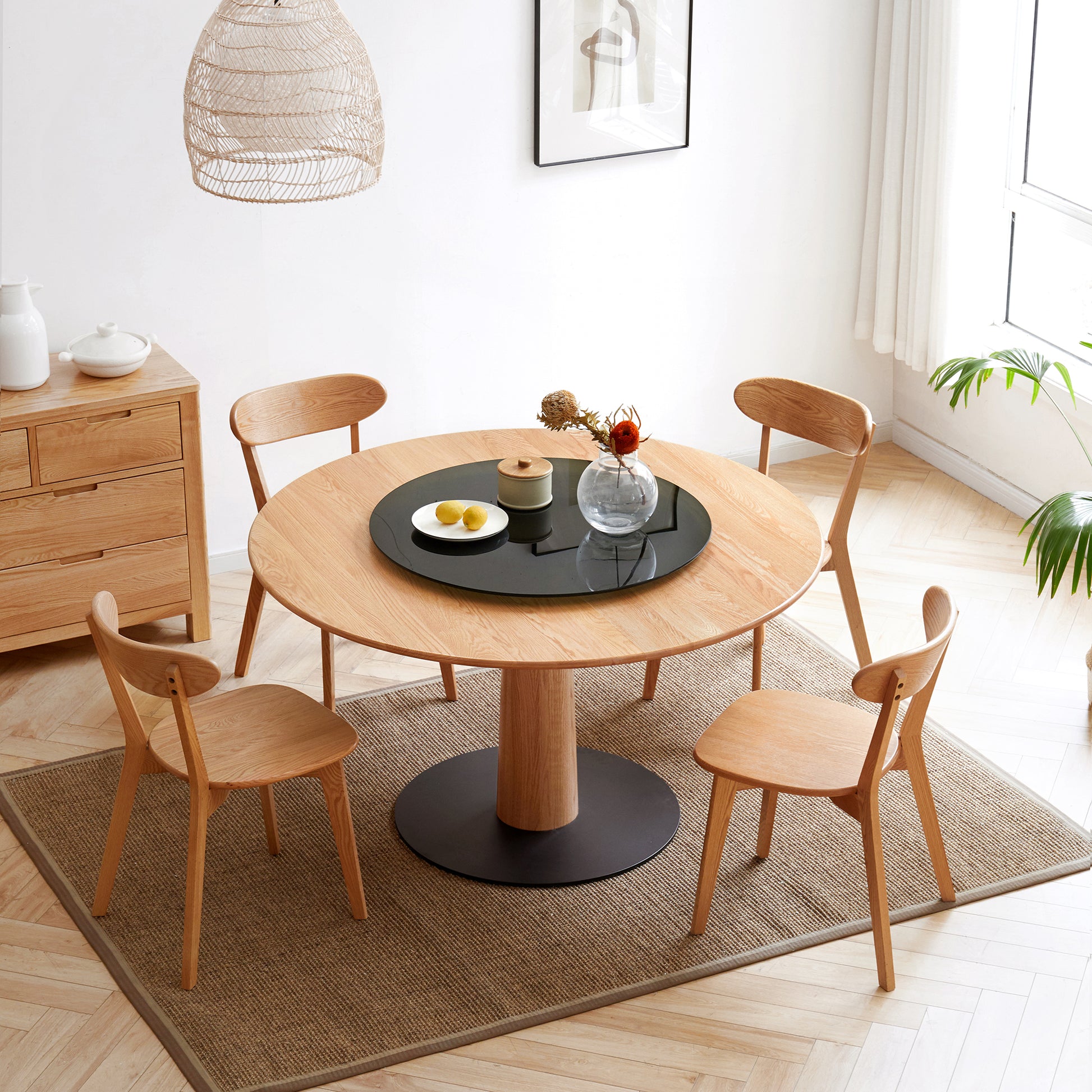 a round table with chairs around it in a room