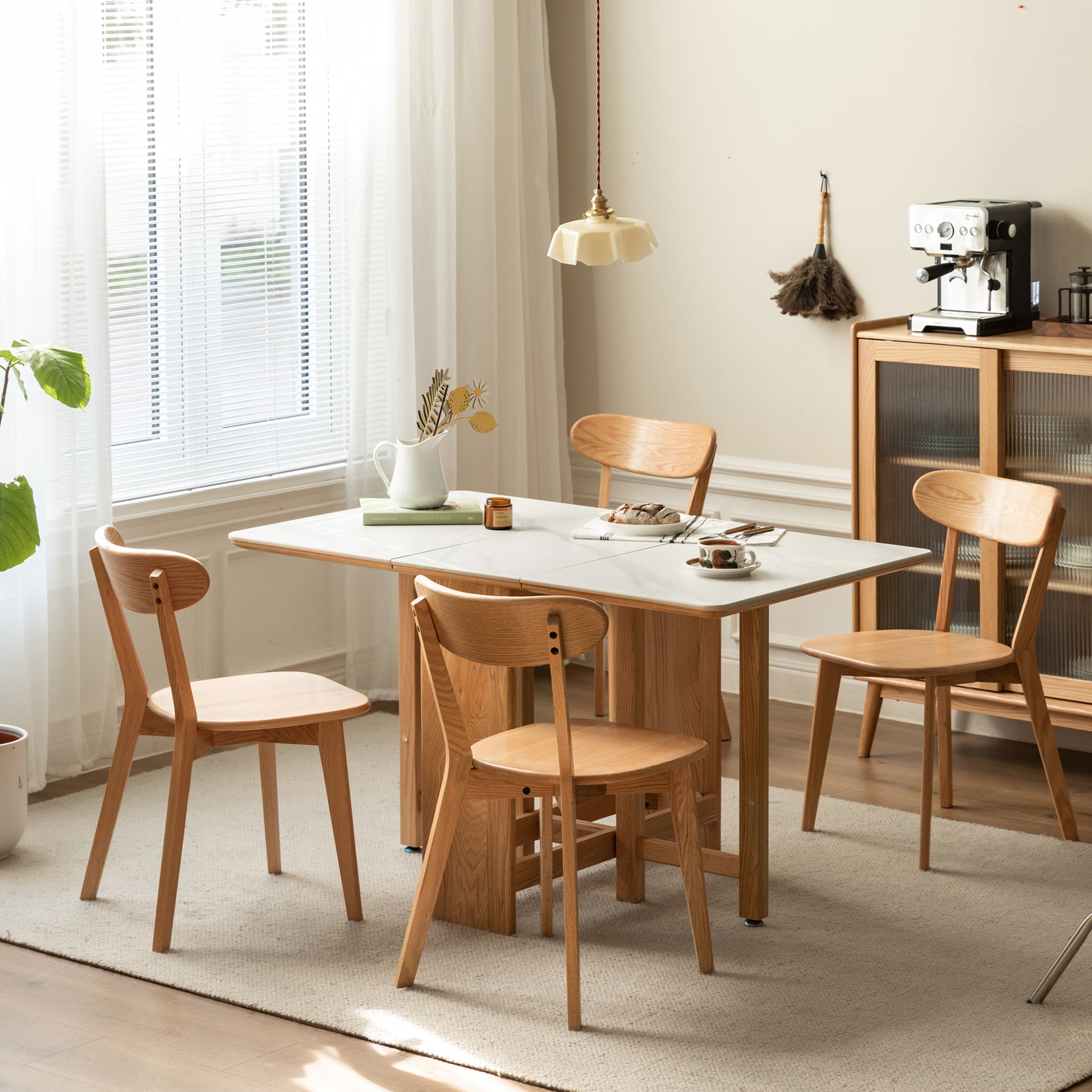 a dining room with a table and chairs