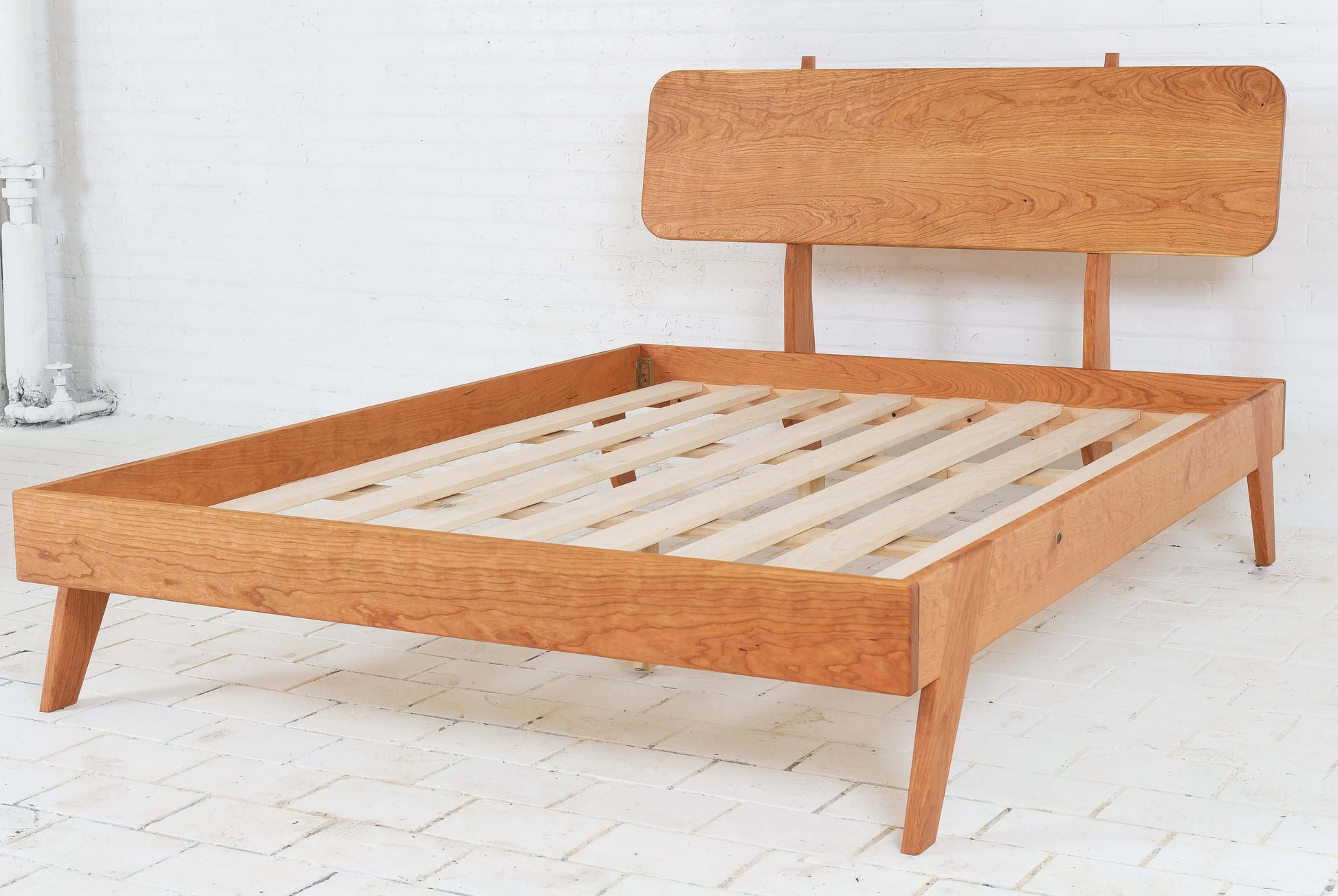 "Sturdy and stylish modern walnut bed frame"