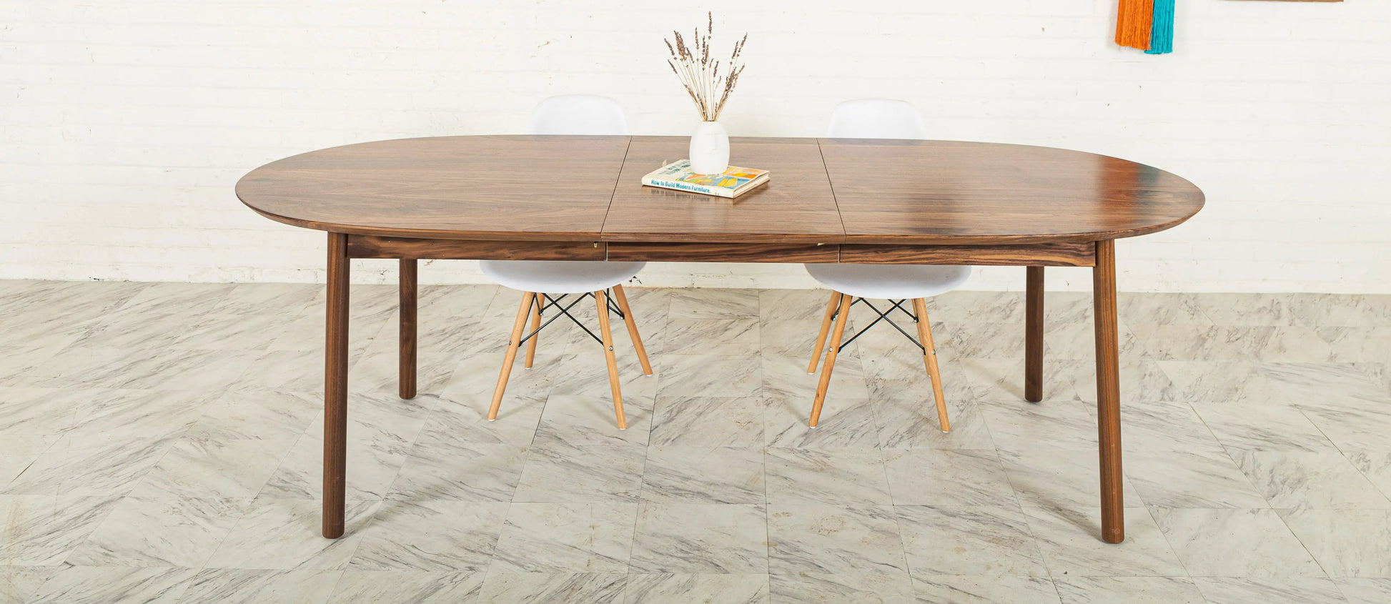 Payne oval extendable dining table for 6-8 set in a contemporary dining room