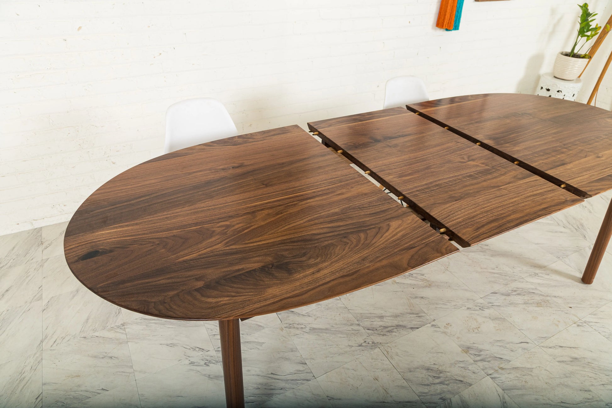 Payne table showcasing its extendable leaf feature