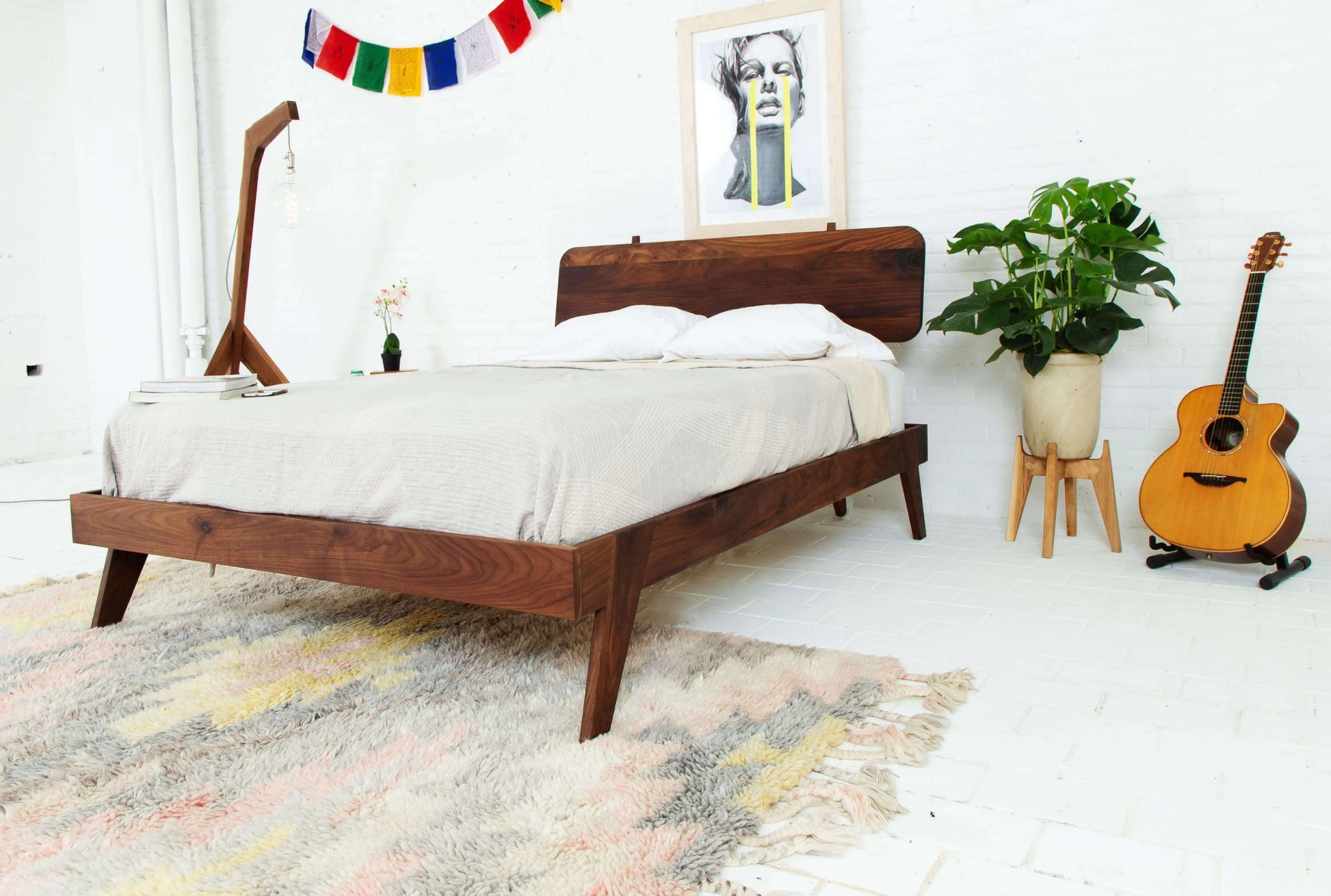 "Dark walnut wood bed frame for a modern bedroom"